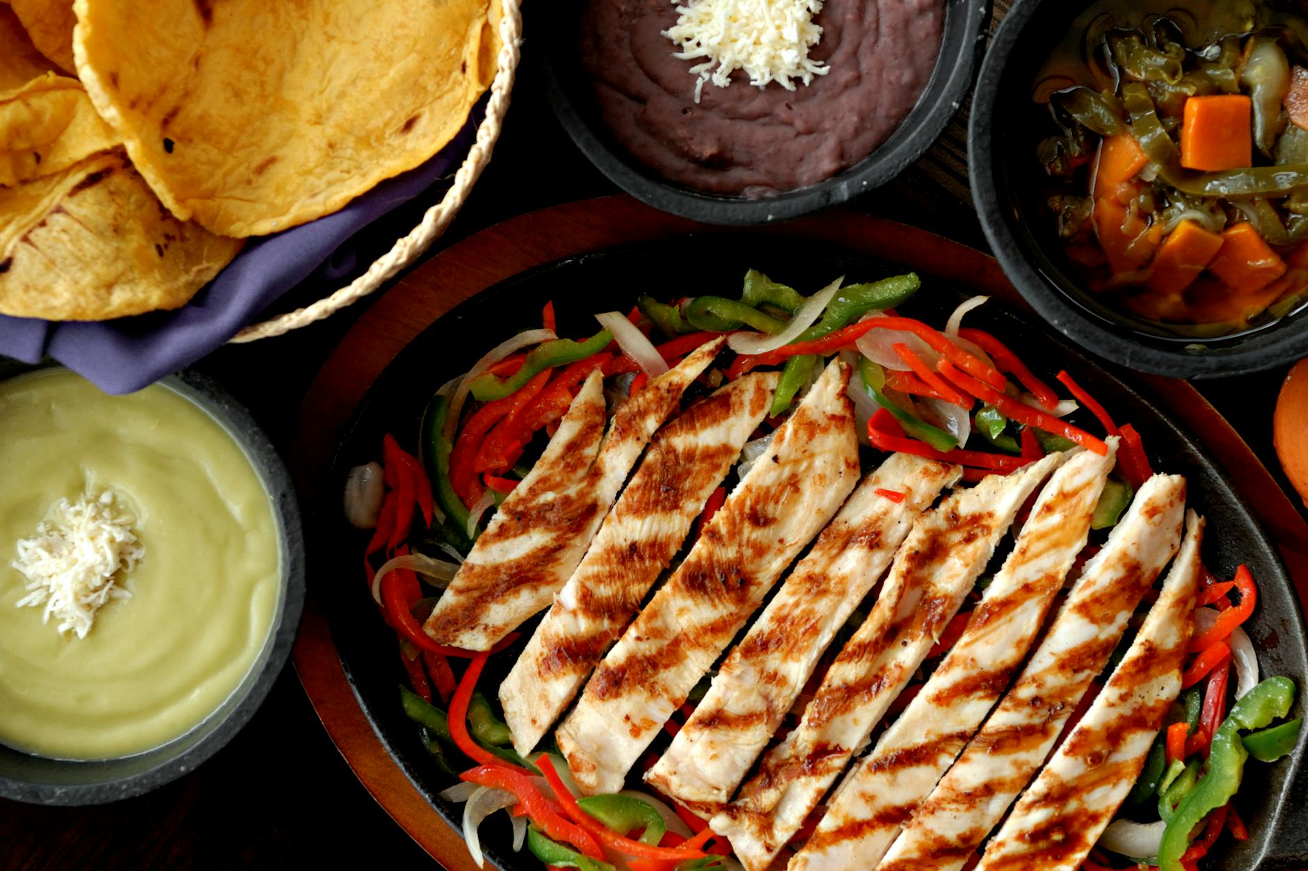 Chicken fajitas with colorful peppers and tortillas
