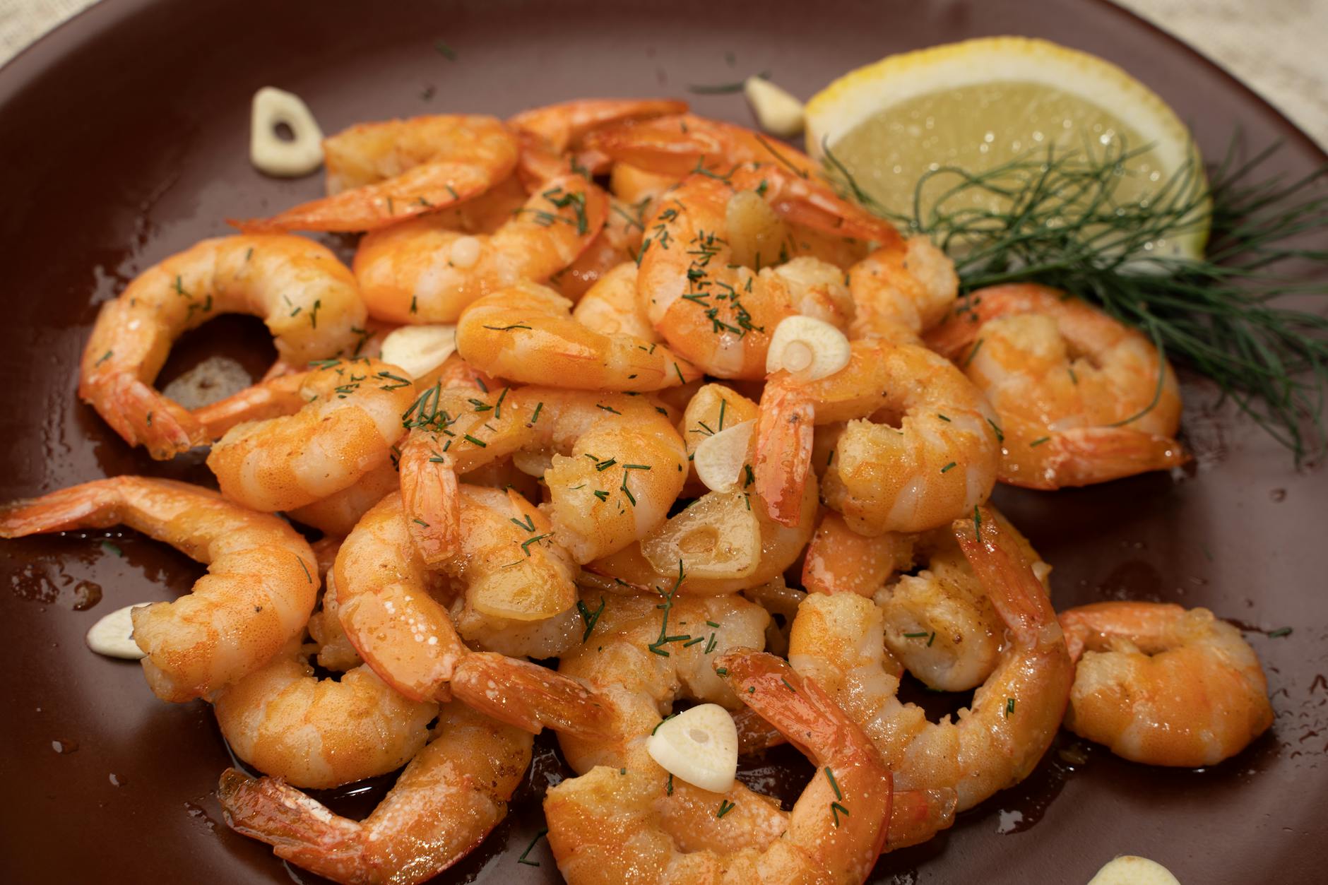 Lemon butter shrimp with garlic and parsley in a pan