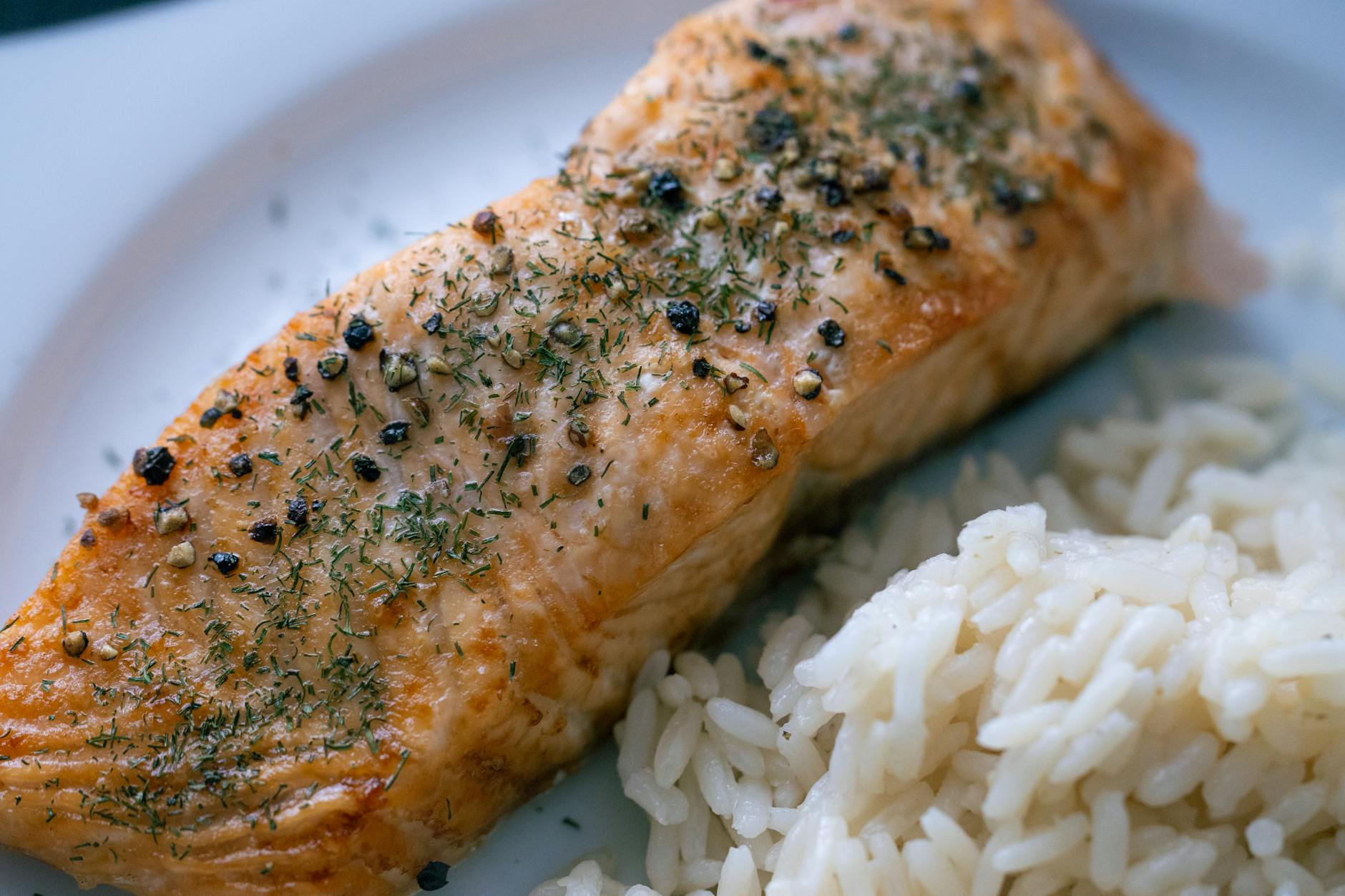 Glazed honey garlic salmon filets in a skillet