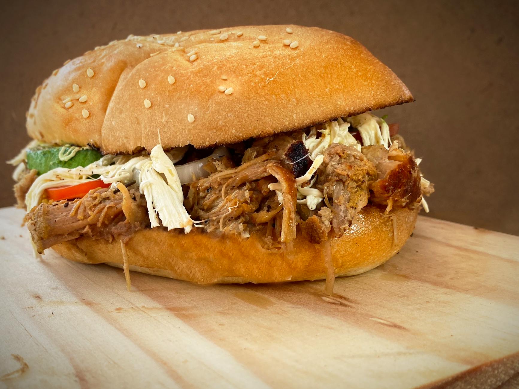 Pulled pork on a sandwich bun with BBQ sauce