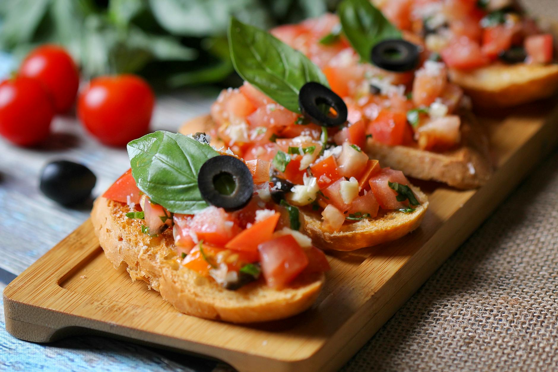Tomato bruschetta on toasted sourdough with basil