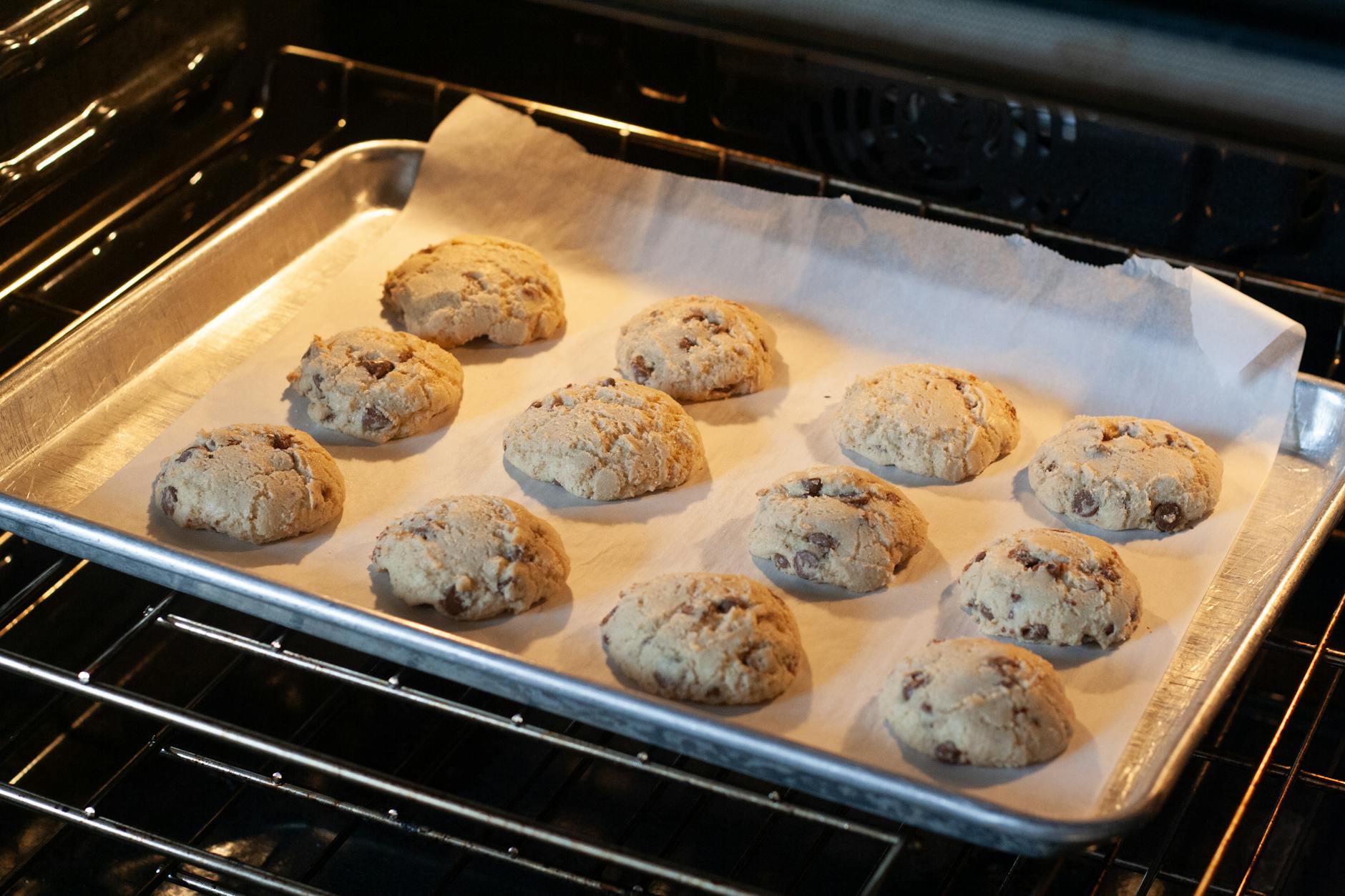 Chewy chocolate chip cookies on a baking sheet