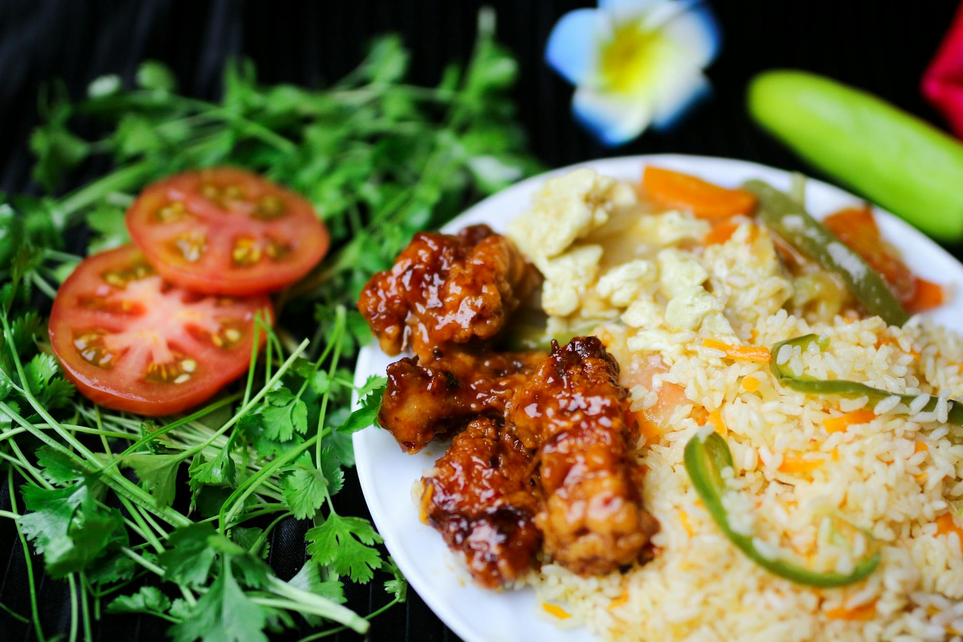 Glazed honey garlic chicken in a skillet with sesame seeds