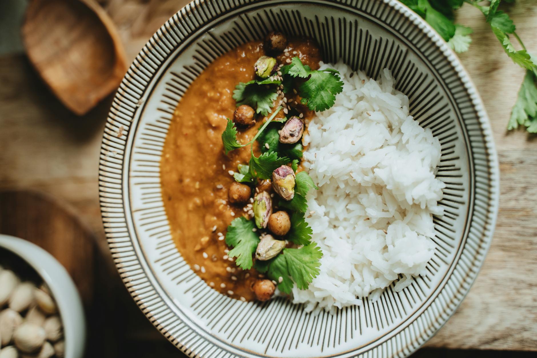 A bowl of golden red lentil dal over rice