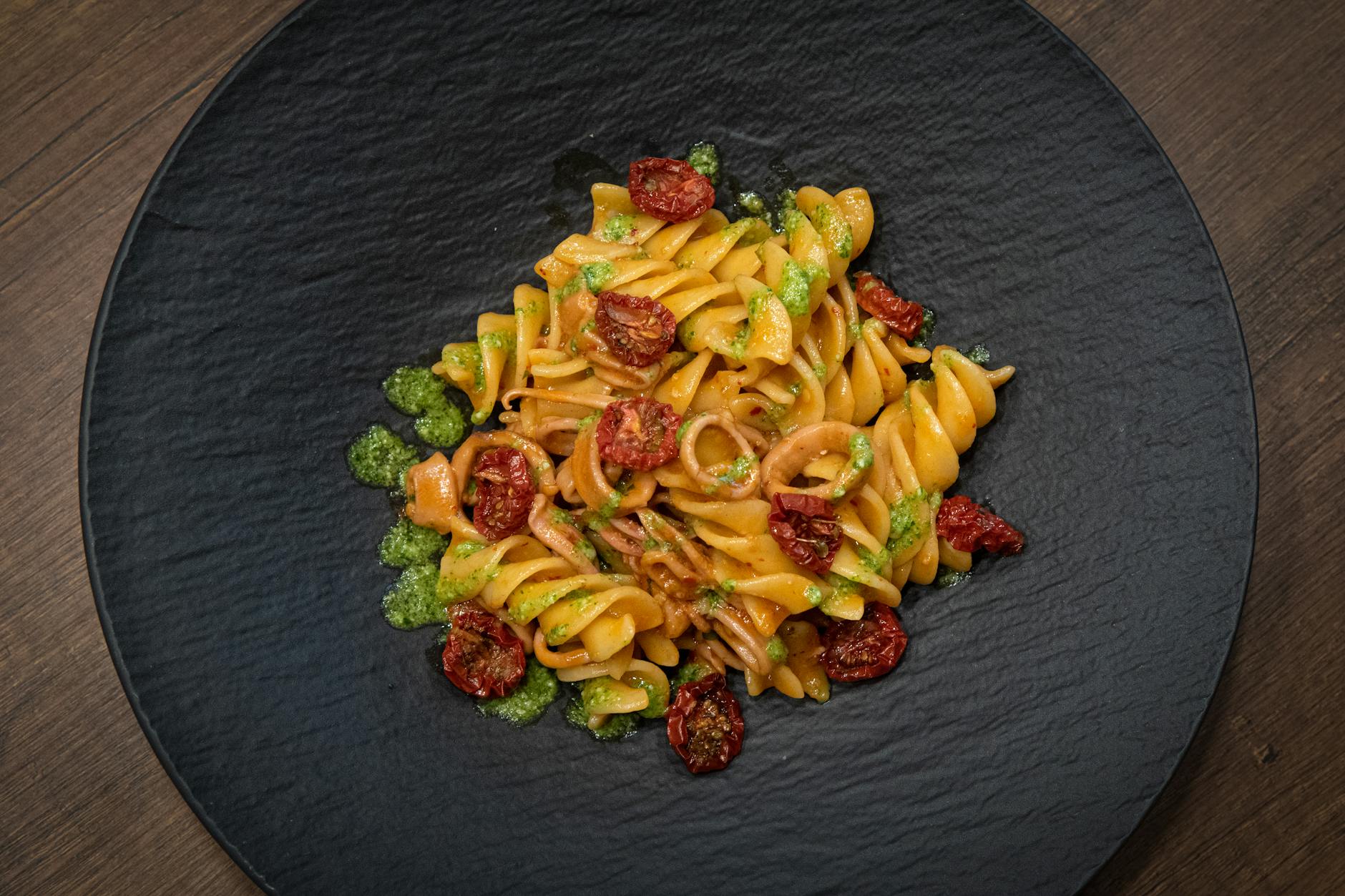 Pesto pasta with cherry tomatoes and fresh mozzarella