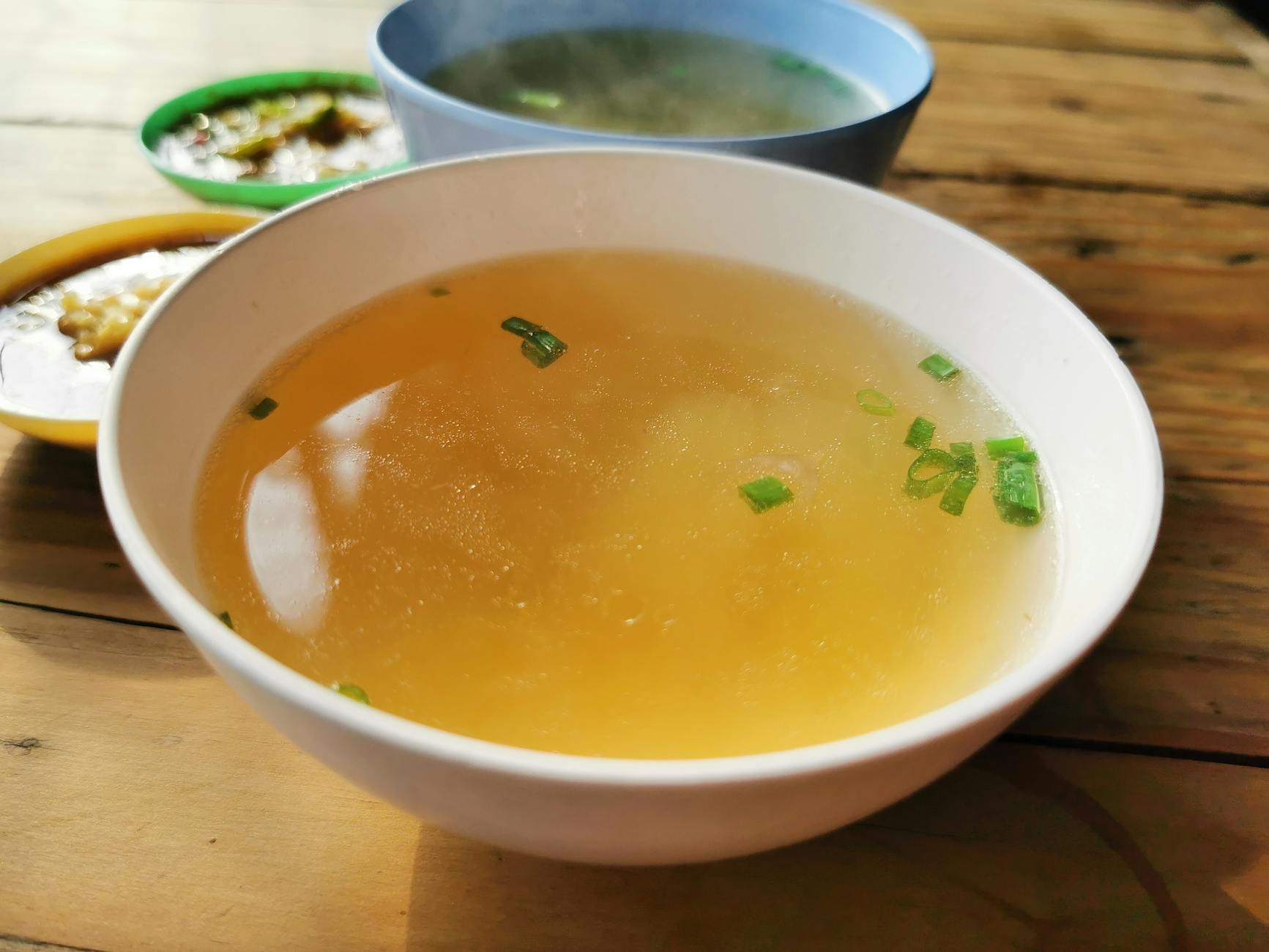 Egg drop soup with silky egg ribbons and green onions