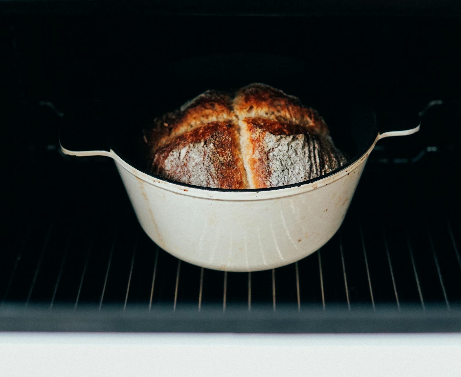 A rustic artisan bread loaf with a golden cracked crust